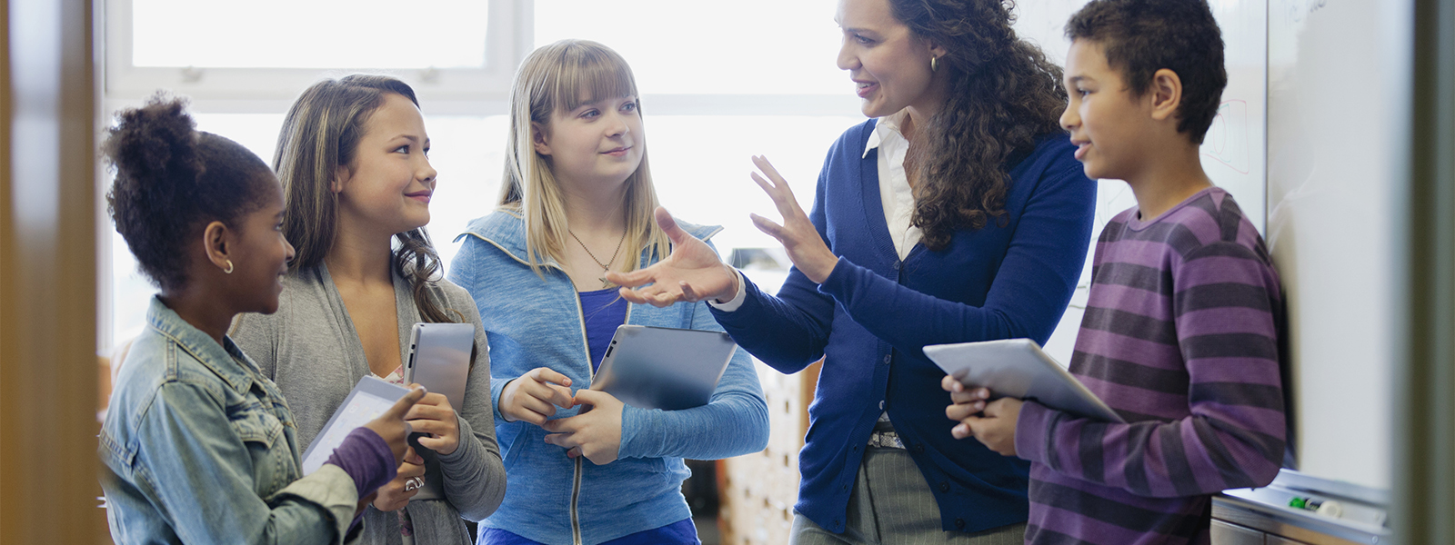 teacher explaining lesson to students